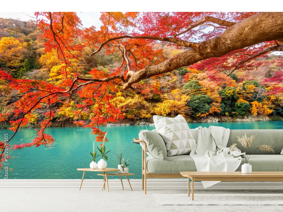 Boatman punting the boat at river. Arashiyama in autumn season along the river in Kyoto, Japan.